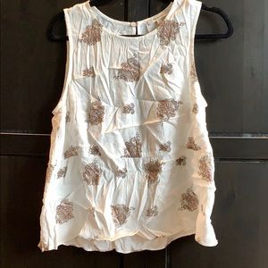 White sleeveless peplum blouse.